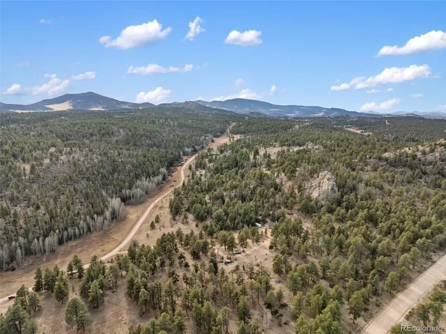 a view of a city with mountains in the background