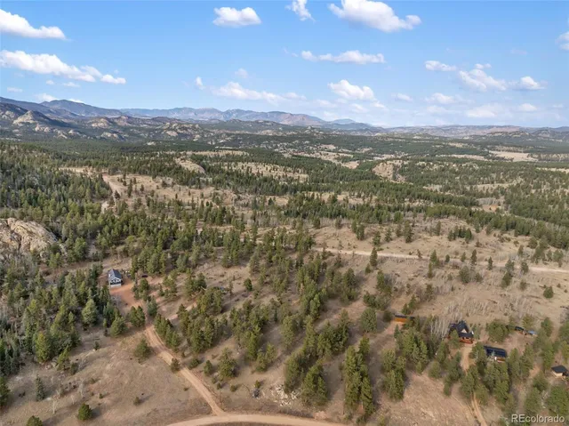 a view of a city with mountains in the background