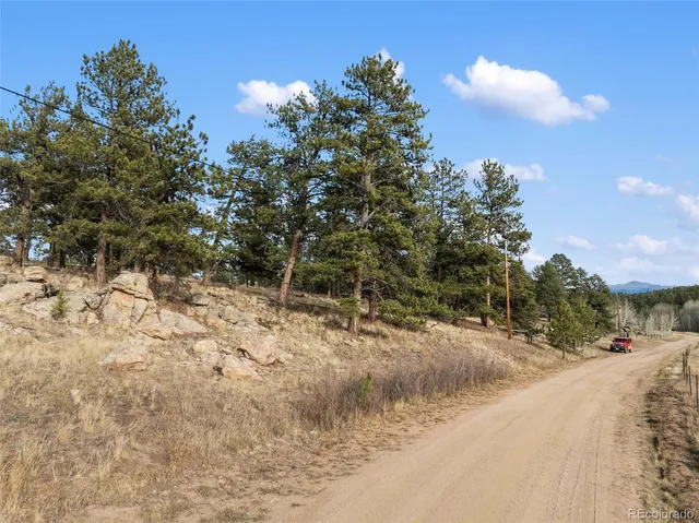 a view of a road with a yard