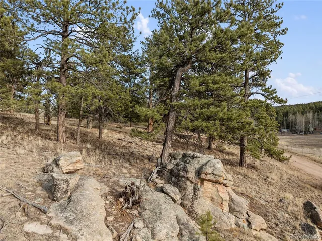 a view of house with yard
