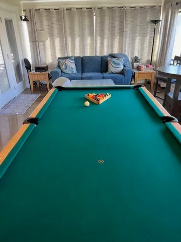 a view of a swimming pool with a yard