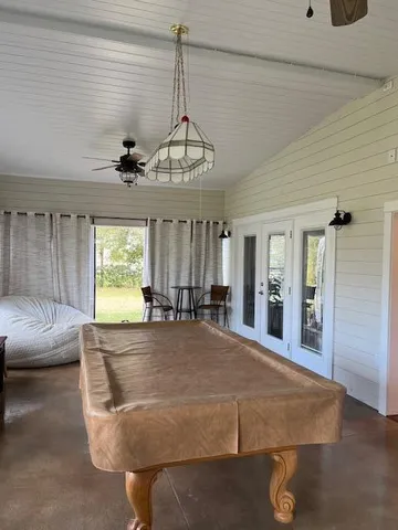 a view of yard with swimming pool and seating