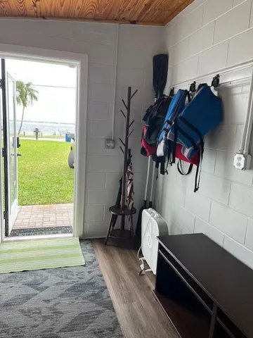 a view of a terrace with lawn chairs