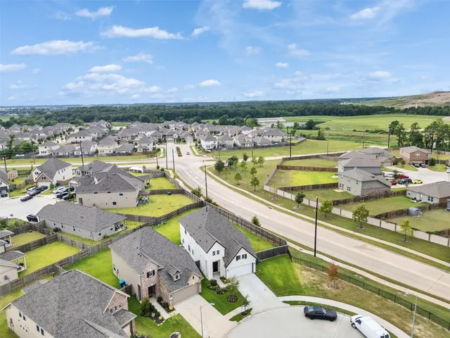 an aerial view of a house with a ocean view