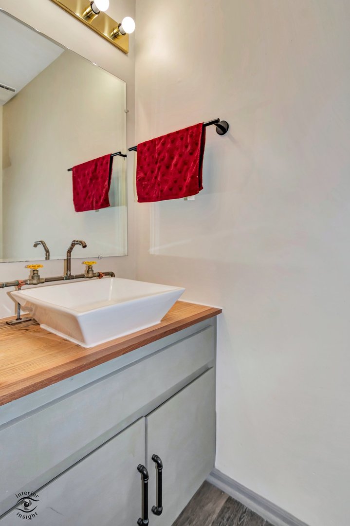 14411 Lamon Avenue Midlothian, IL 60445 - Photo 14 of 26 a bathroom with a sink and a mirror