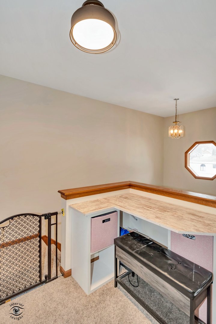 14411 Lamon Avenue Midlothian, IL 60445 - Photo 15 of 26 a view of a room with racks on the wall