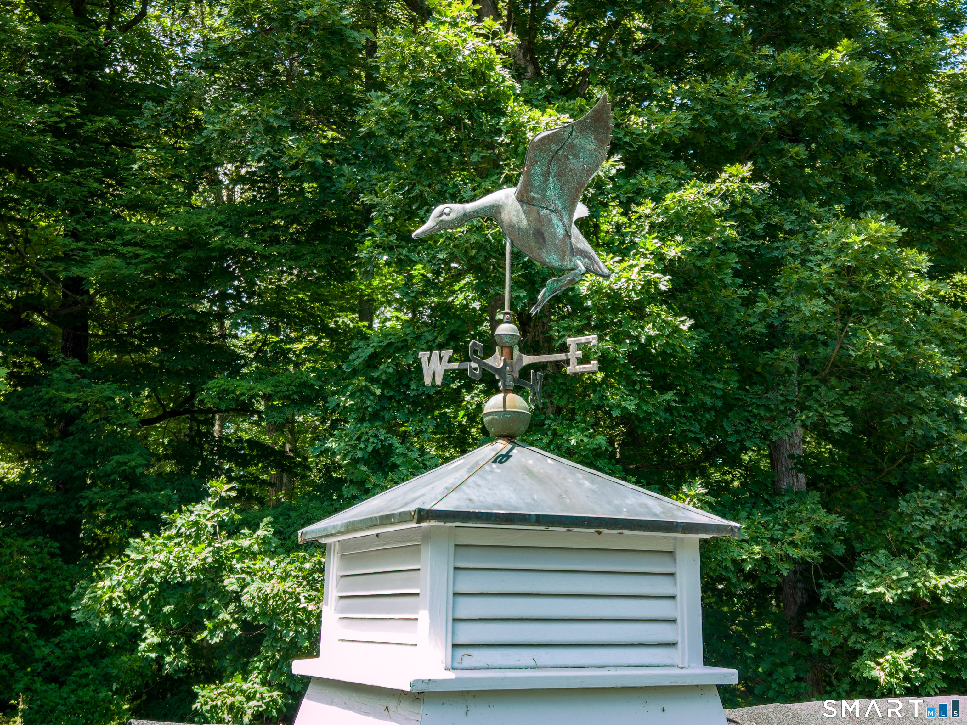 760 Smith Ridge Road New Canaan, CT 06840 - Photo 33 of 40 a front view of a house with a yard