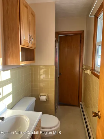 a bathroom with a sink a toilet and tub