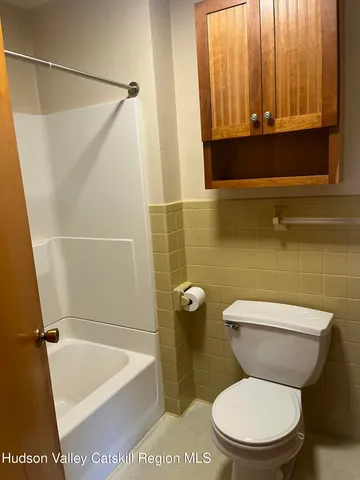 a bathroom with a toilet a sink and bathtub