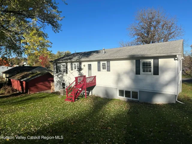 a view of a house with a yard balcony