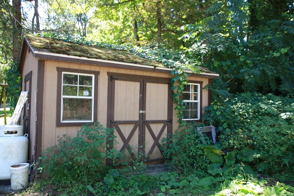 16 Crescent Street Huntington, MA 01050 - Photo 2 of 6 a front view of a house with garden