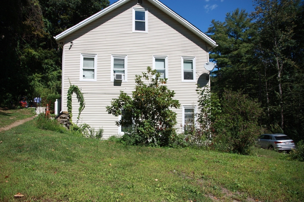 16 Crescent Street Huntington, MA 01050 - Photo 5 of 6 a view of a house with backyard and garden