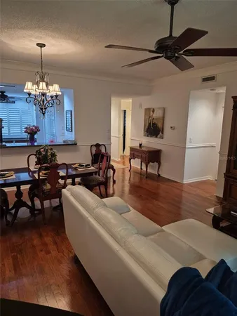 a living room with furniture rug and window