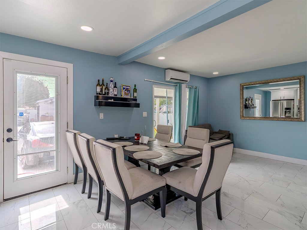 1130 West Chestnut Avenue Santa Ana, CA 92703 - Photo 5 of 20 a view of a dining room with furniture and a large window