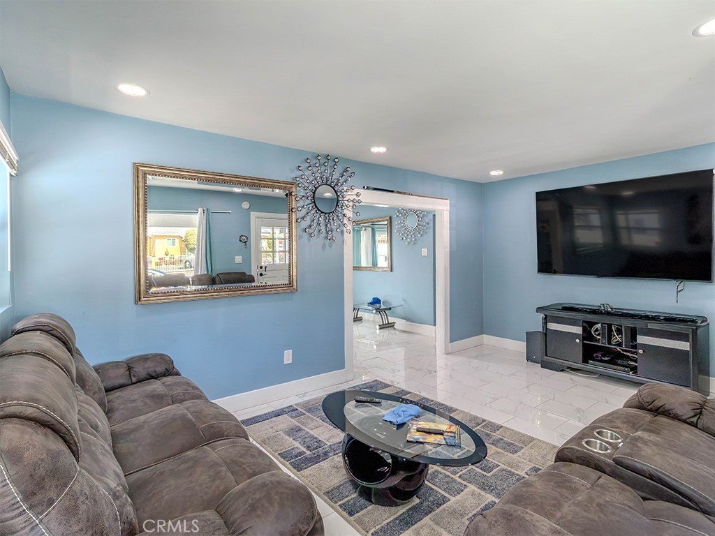 1130 West Chestnut Avenue Santa Ana, CA 92703 - Photo 7 of 20 a living room with furniture and a flat screen tv