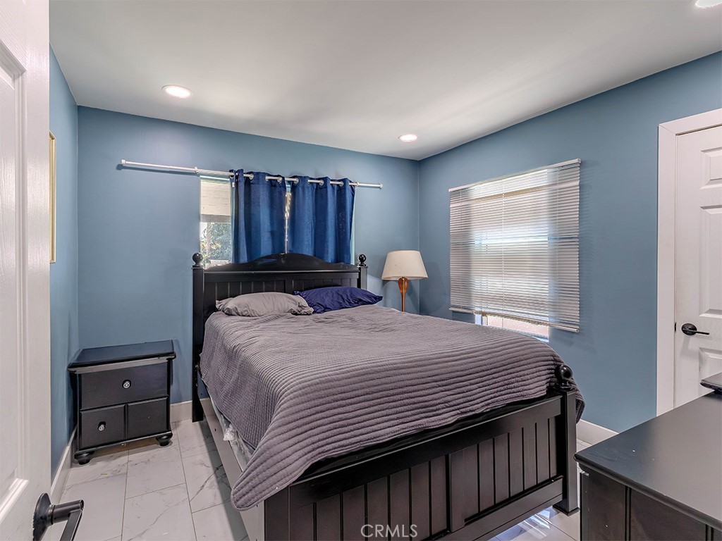 1130 West Chestnut Avenue Santa Ana, CA 92703 - Photo 10 of 20 a bedroom with a bed and window