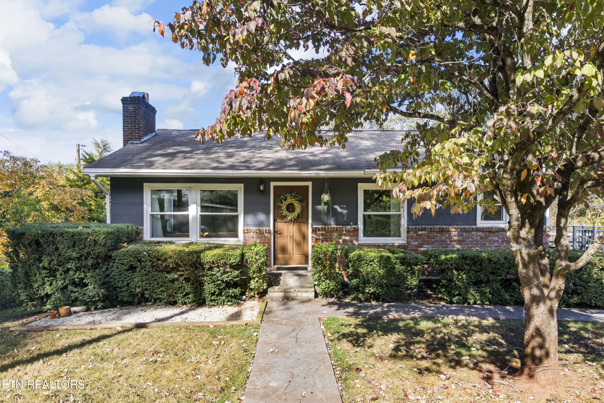 a front view of a house with garden