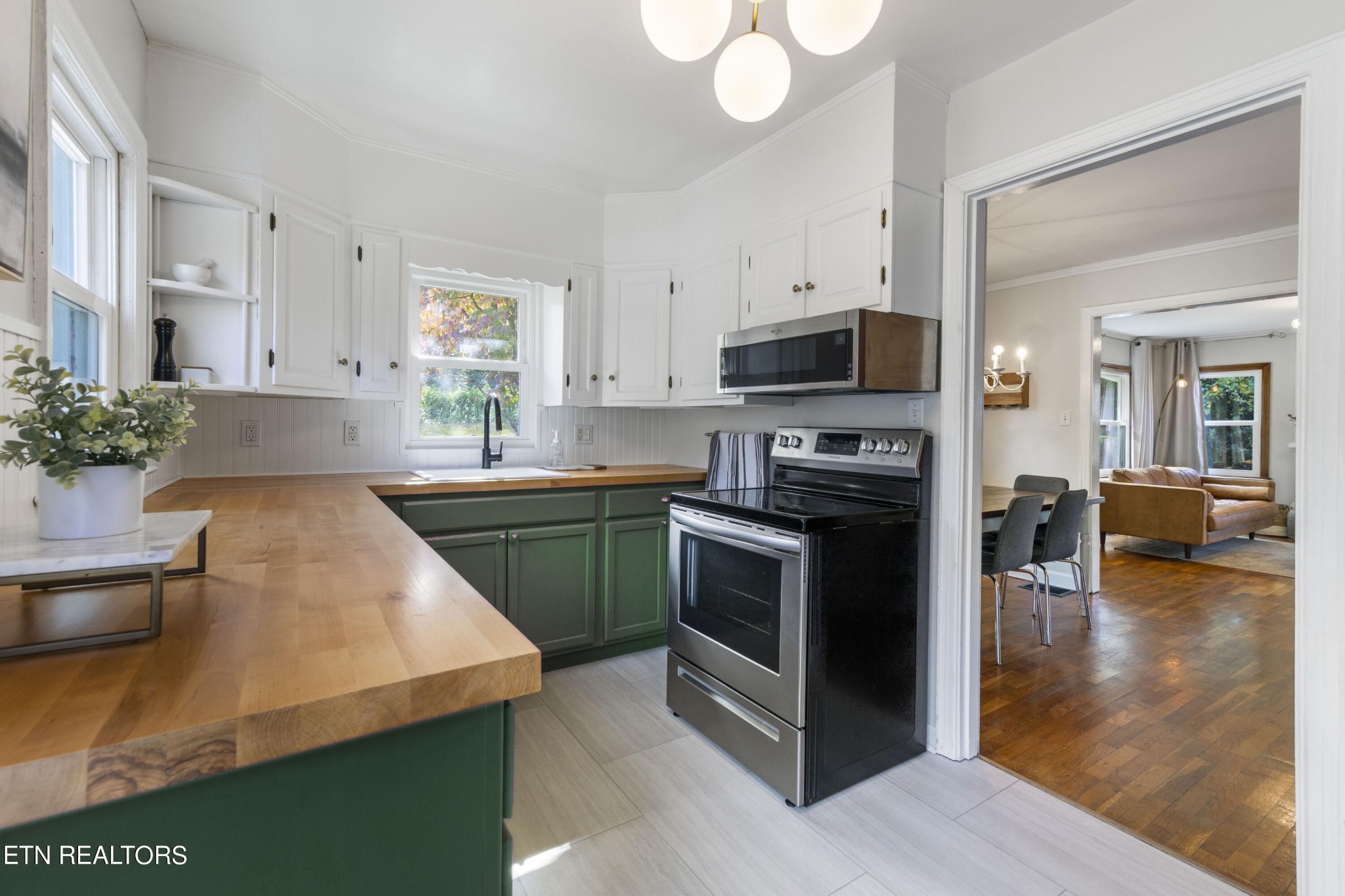 405 Mark Road Knoxville, TN 37920 - Photo 12 of 24 a kitchen with granite countertop a stove and cabinets