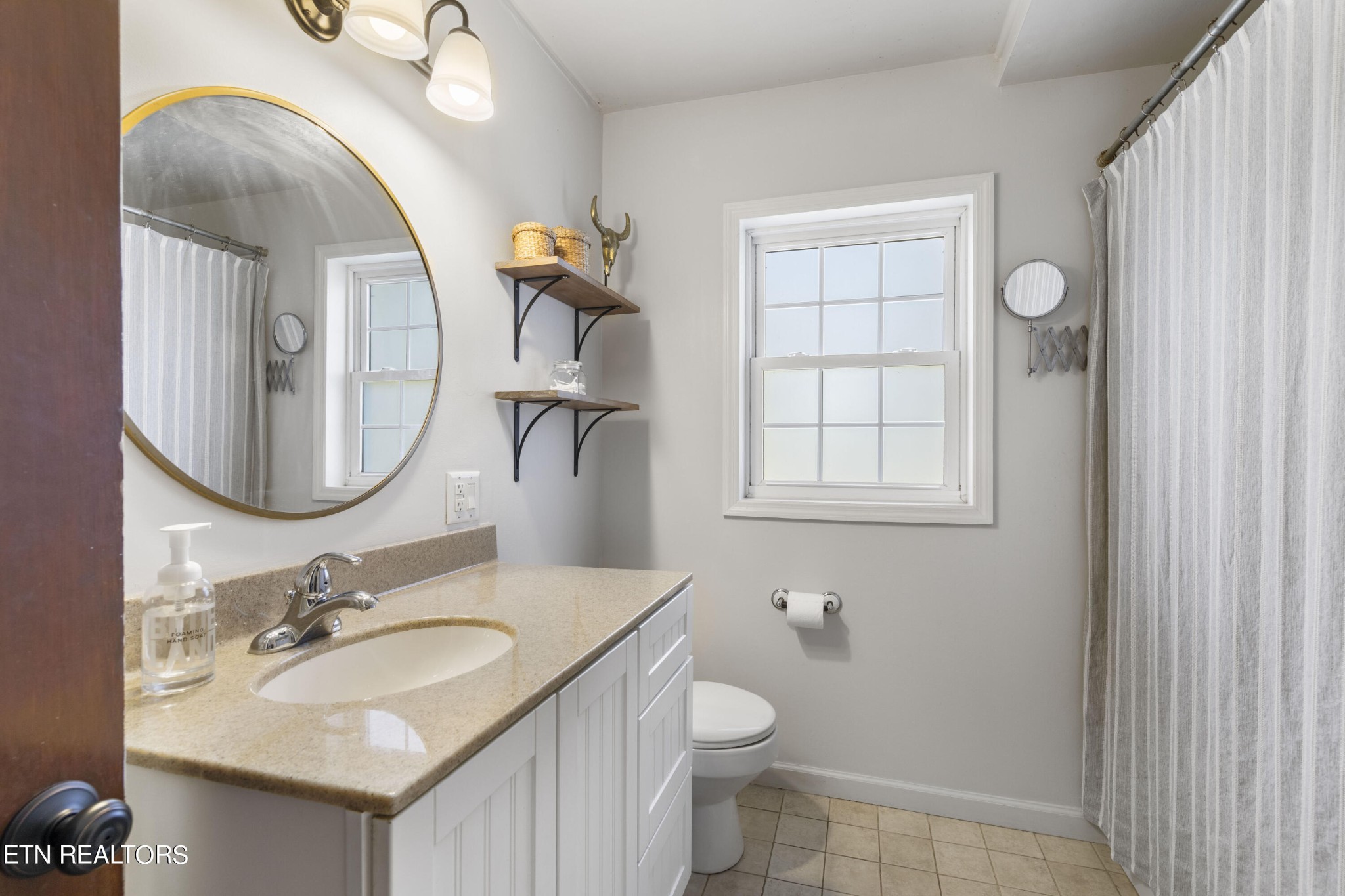 405 Mark Road Knoxville, TN 37920 - Photo 18 of 24 a bathroom with a sink and a mirror