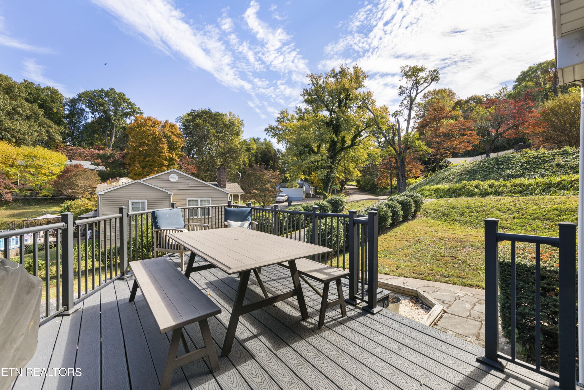 405 Mark Road Knoxville, TN 37920 - Photo 24 of 24 a view of a roof deck with table and chairs with wooden floor and fence