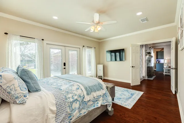 a room with a bed and a dresser