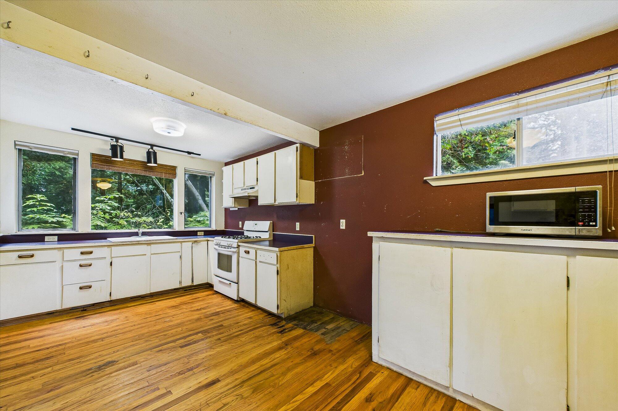 119 Sylva Street Arcata, CA 95521 - Photo 17 of 35 a kitchen with stainless steel appliances a stove top oven a sink and a refrigerator