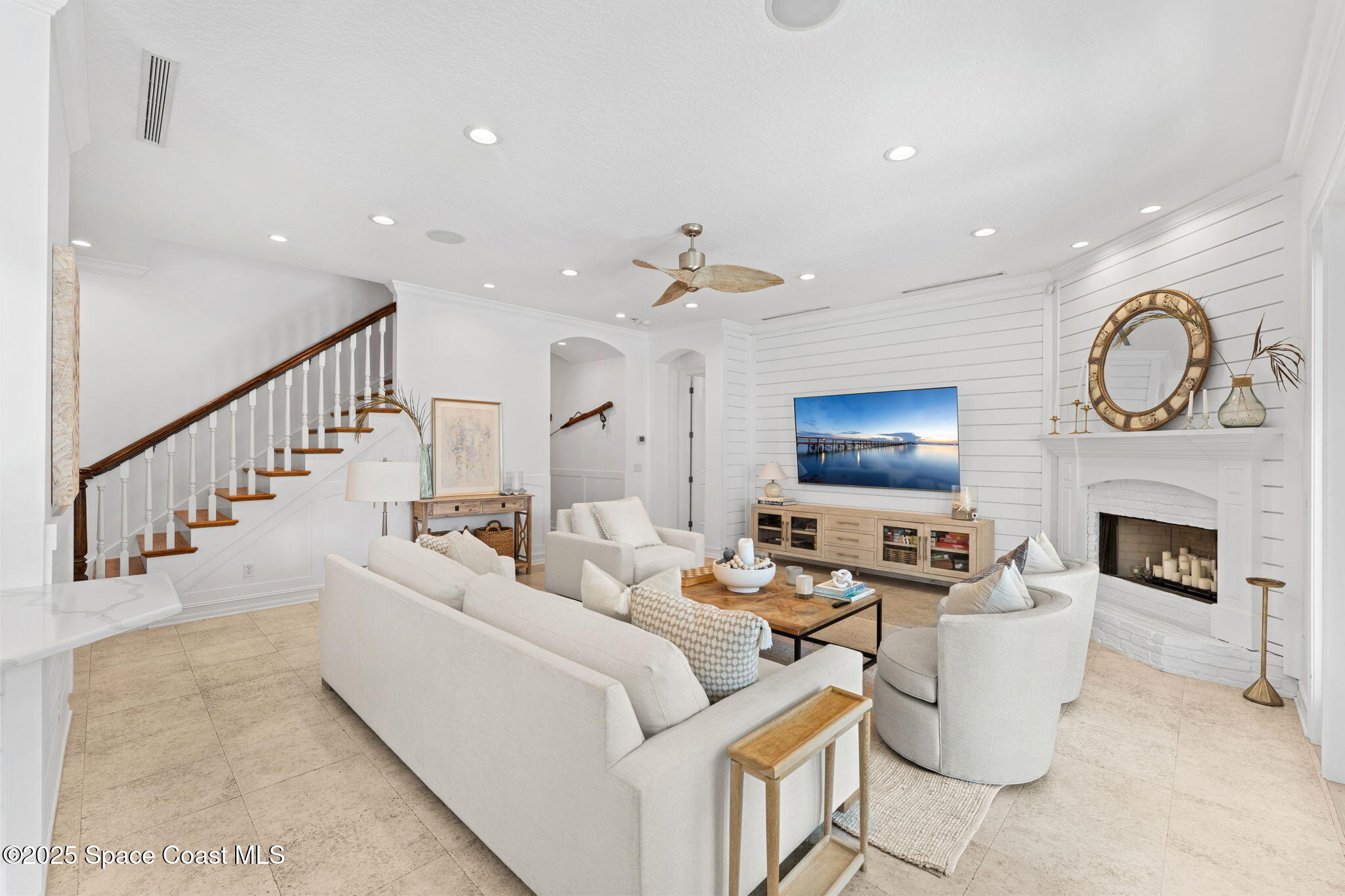 133 Windemere Place Melbourne Beach, FL 32951 - Photo 12 of 75 a living room with furniture and a fireplace