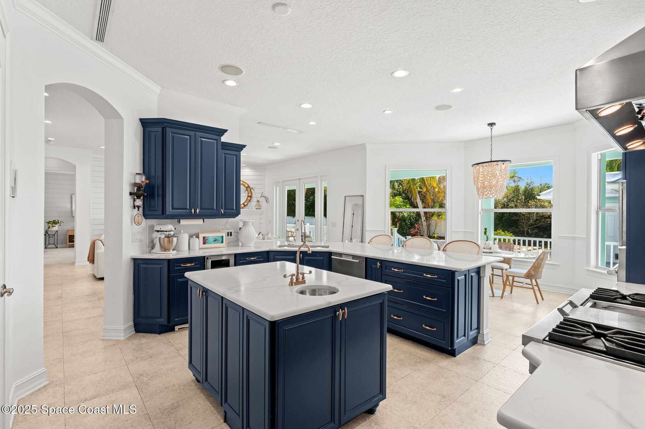 133 Windemere Place Melbourne Beach, FL 32951 - Photo 16 of 75 a kitchen with a sink stove and cabinets