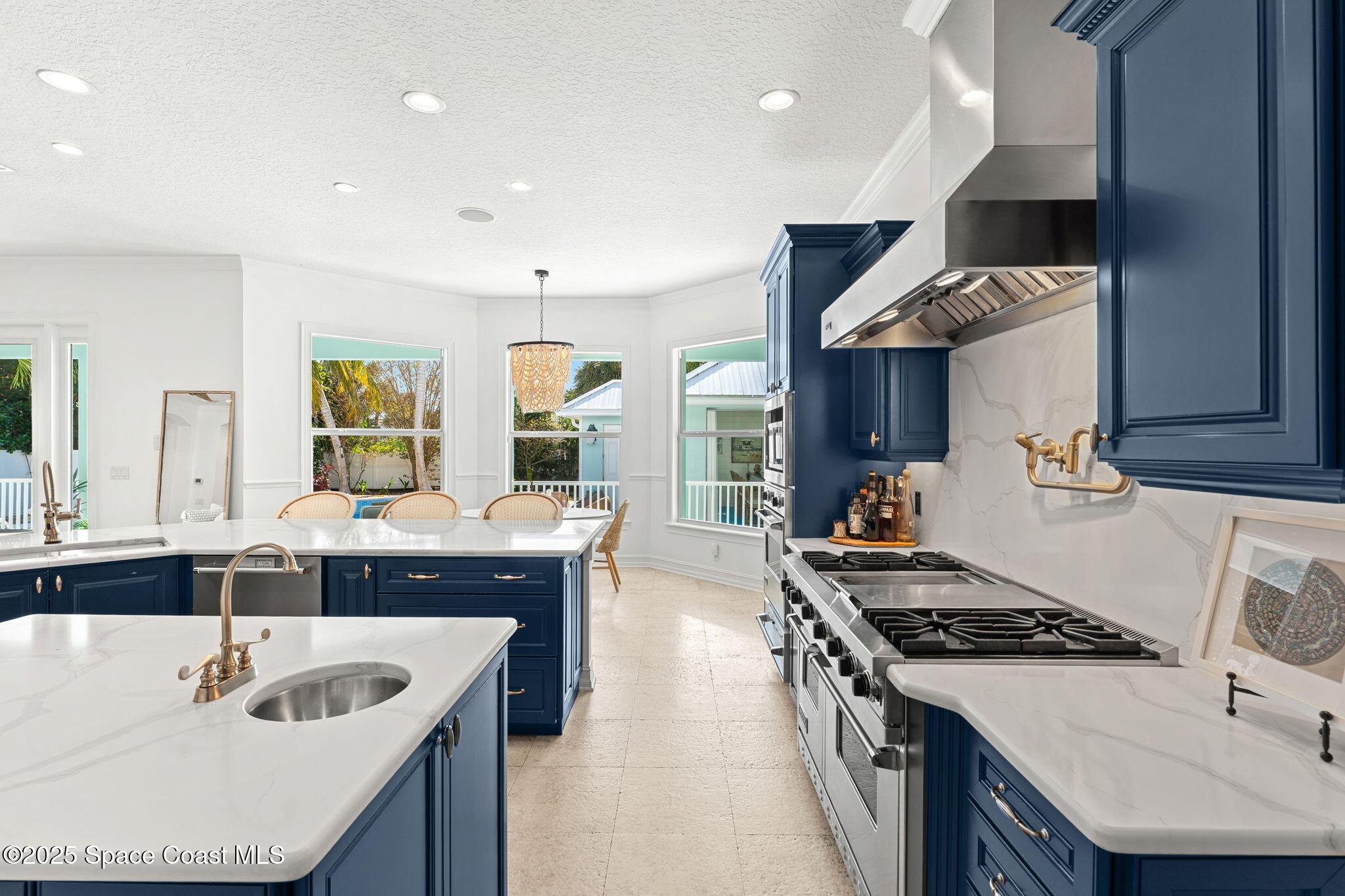 133 Windemere Place Melbourne Beach, FL 32951 - Photo 19 of 75 a kitchen with stainless steel appliances granite countertop a sink stove and refrigerator