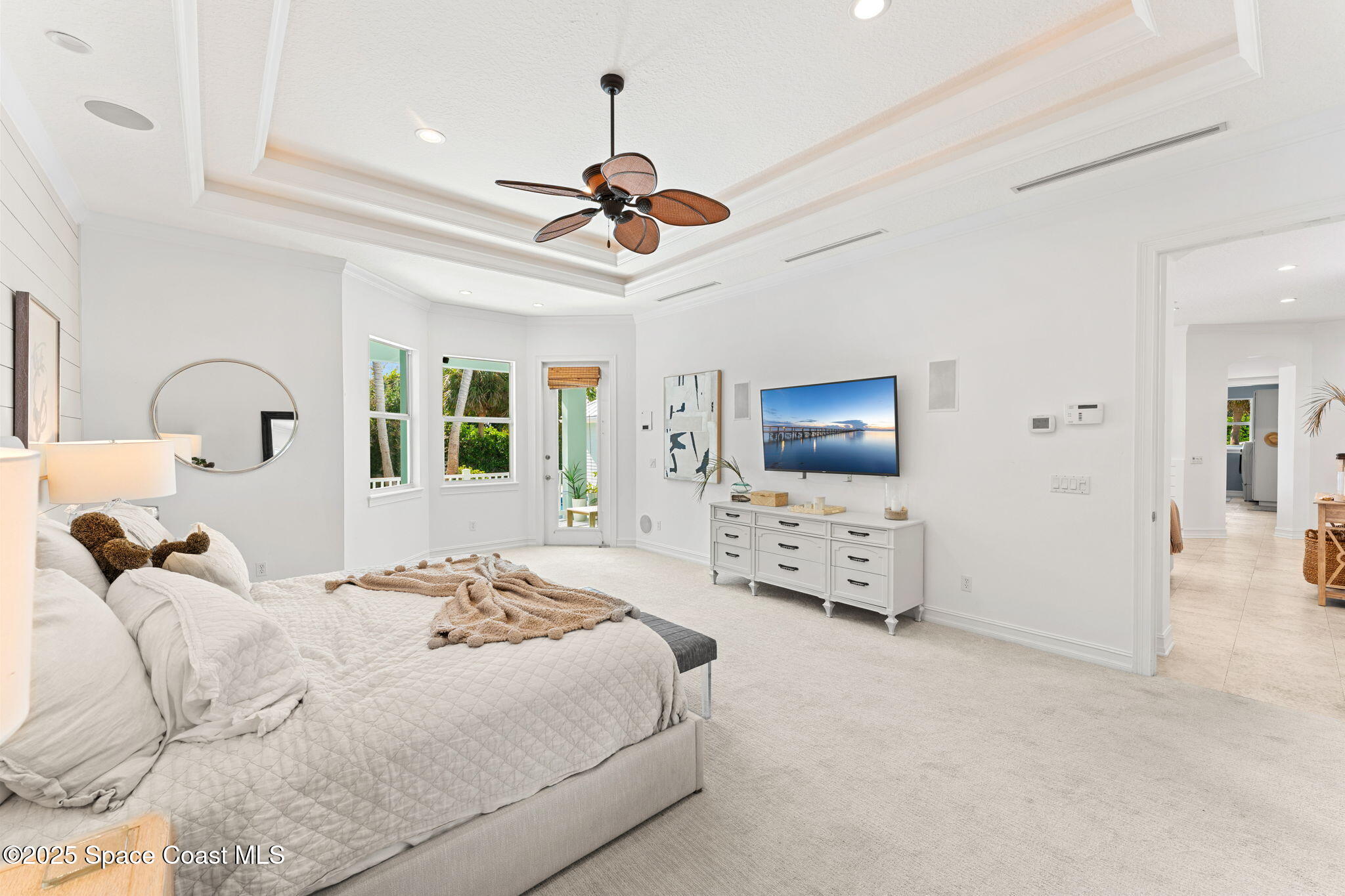 133 Windemere Place Melbourne Beach, FL 32951 - Photo 20 of 75 a bedroom with furniture and a flat screen tv