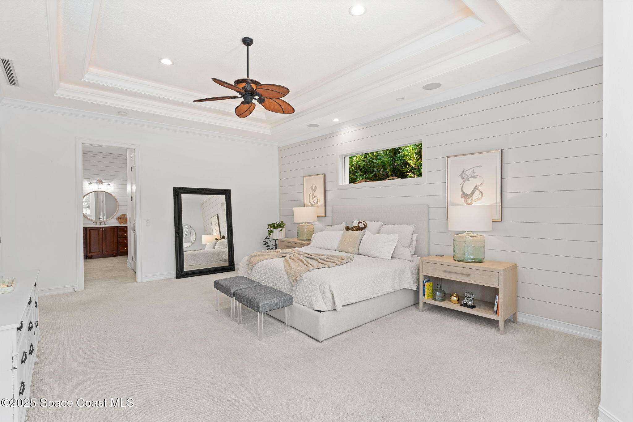 133 Windemere Place Melbourne Beach, FL 32951 - Photo 21 of 75 a spacious bedroom with a bed chandelier painting on the wall and a chandelier