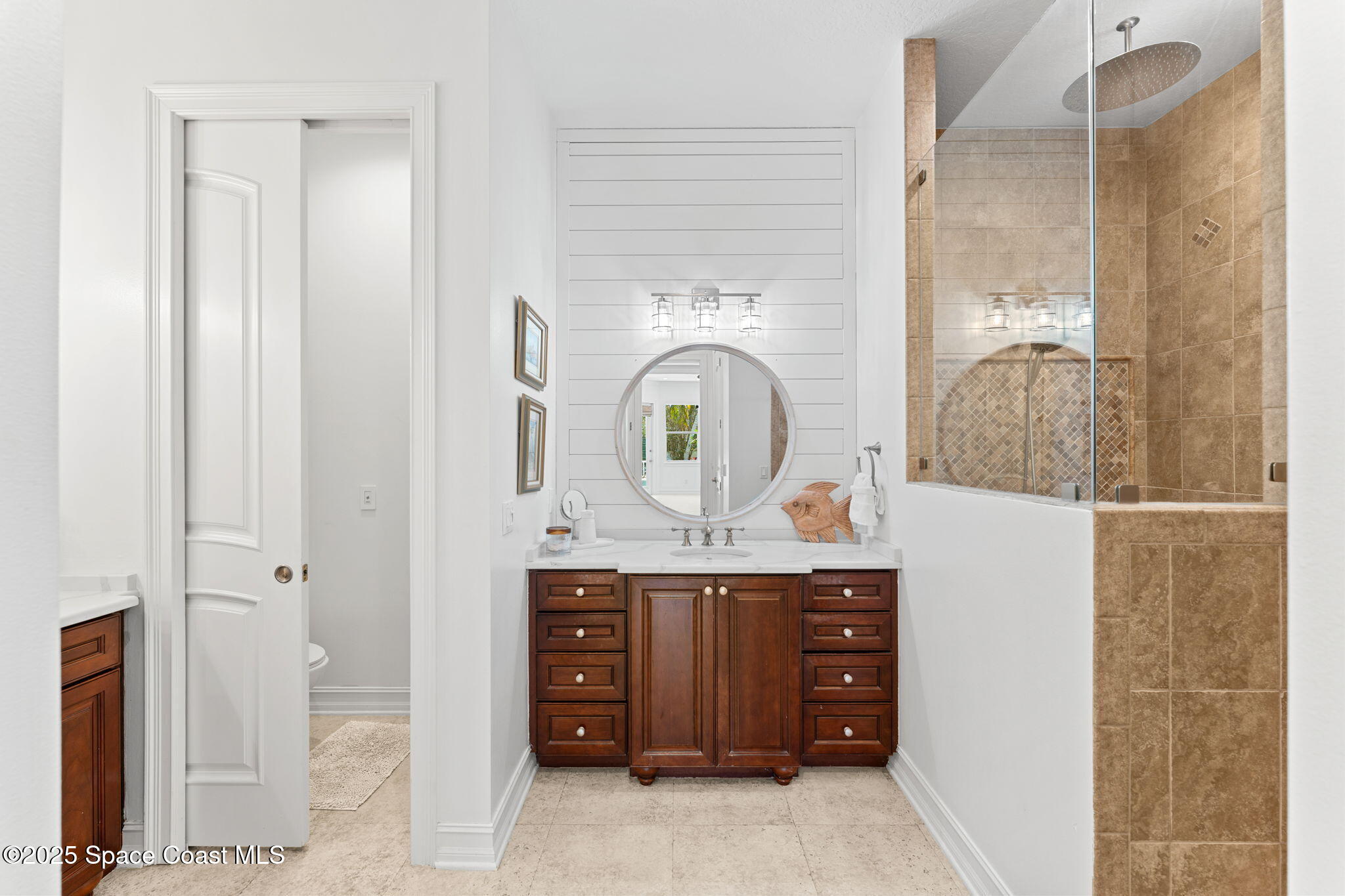 133 Windemere Place Melbourne Beach, FL 32951 - Photo 23 of 75 a view of cabinet with mirror