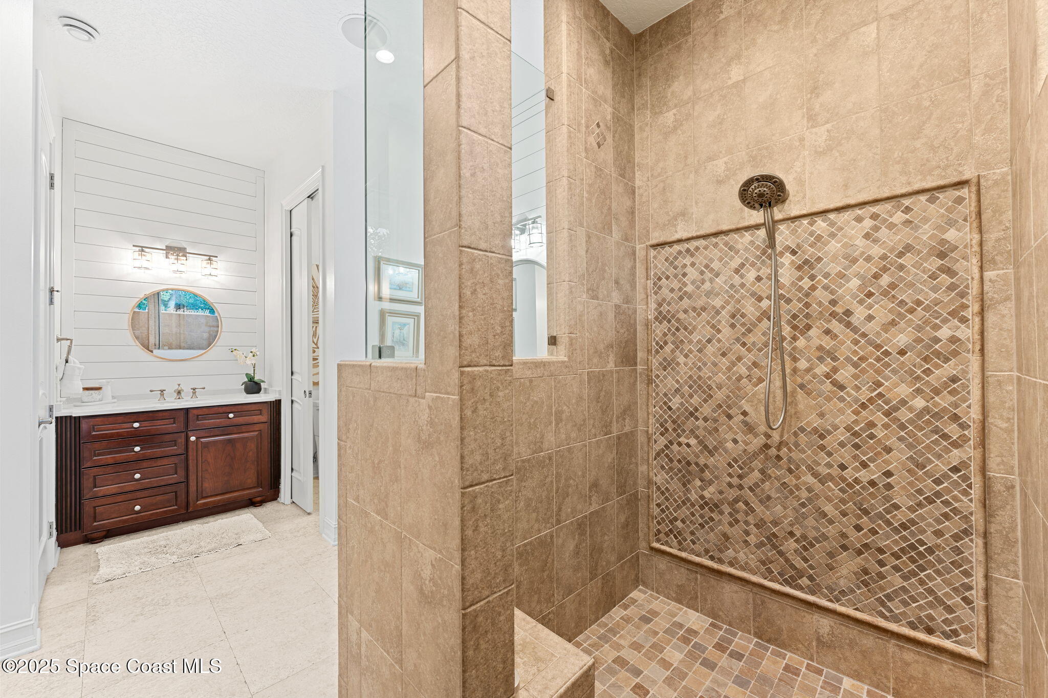 133 Windemere Place Melbourne Beach, FL 32951 - Photo 24 of 75 a bathroom with a granite countertop shower a sink and a mirror