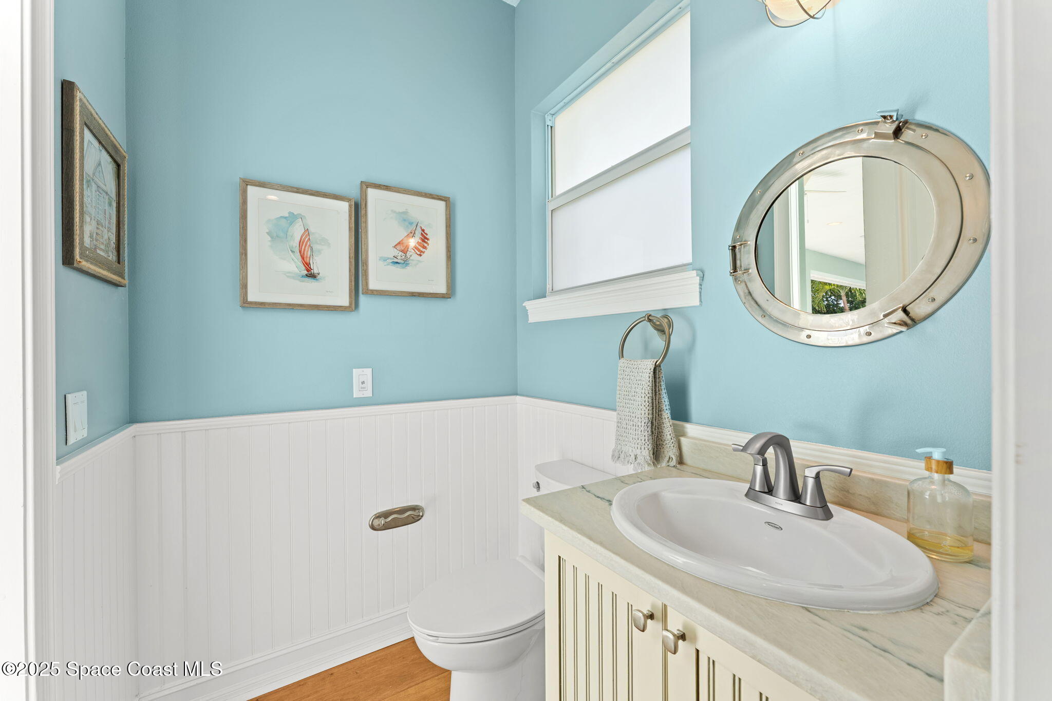 133 Windemere Place Melbourne Beach, FL 32951 - Photo 27 of 75 a bathroom with a sink and a mirror