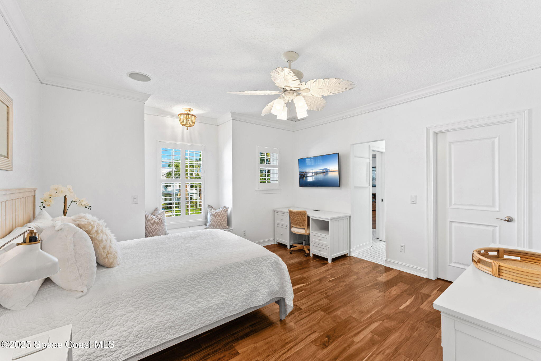 133 Windemere Place Melbourne Beach, FL 32951 - Photo 35 of 75 a bedroom with a bed and wooden floor