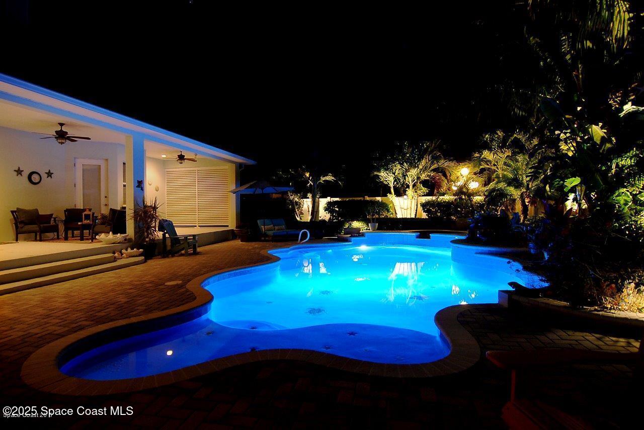 133 Windemere Place Melbourne Beach, FL 32951 - Photo 57 of 75 a room with pool table and couches chairs with swimming pool