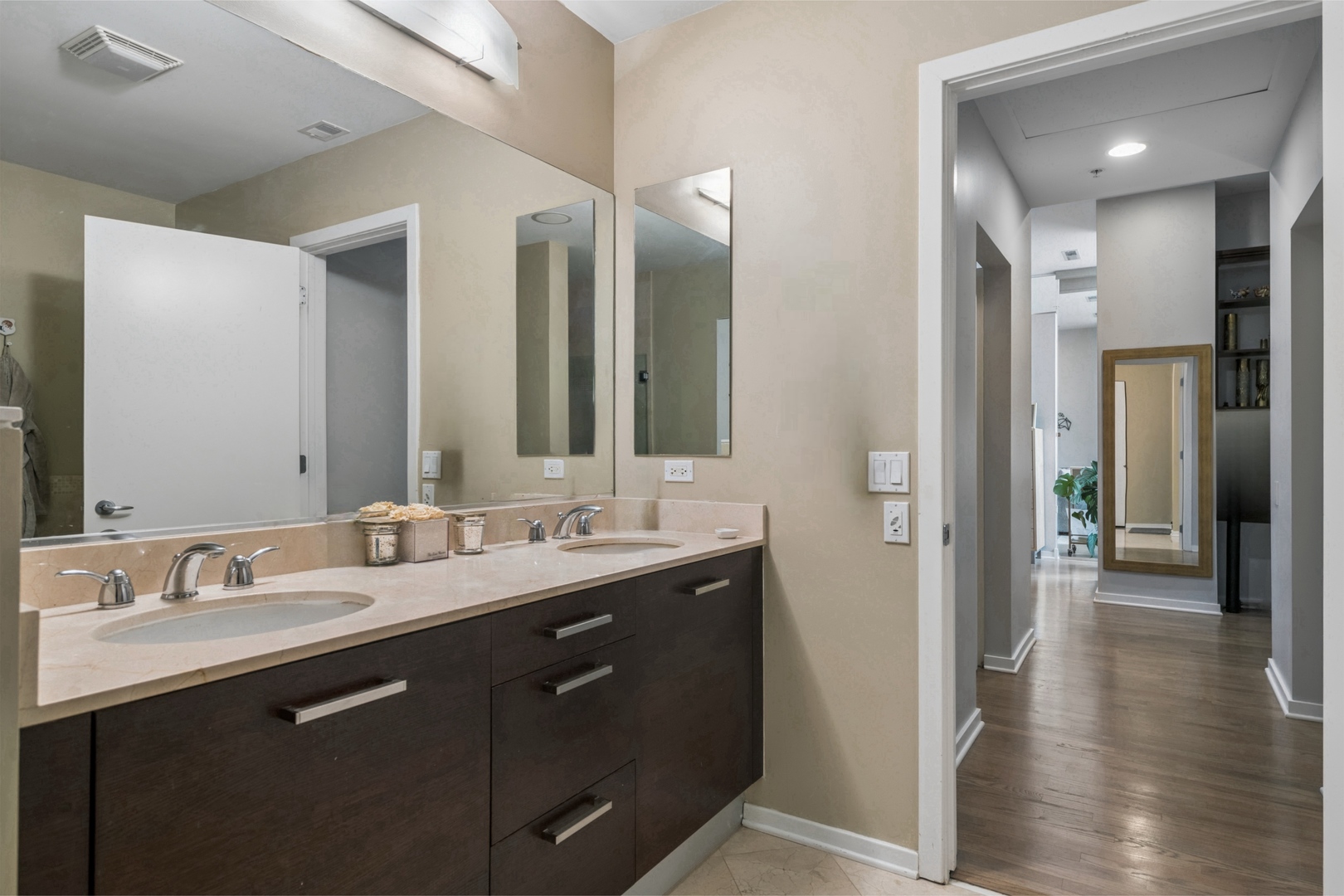 500 West Superior Street, Unit 813 Chicago, IL 60654 - Photo 11 of 18 a bathroom with a double vanity sink and a mirror