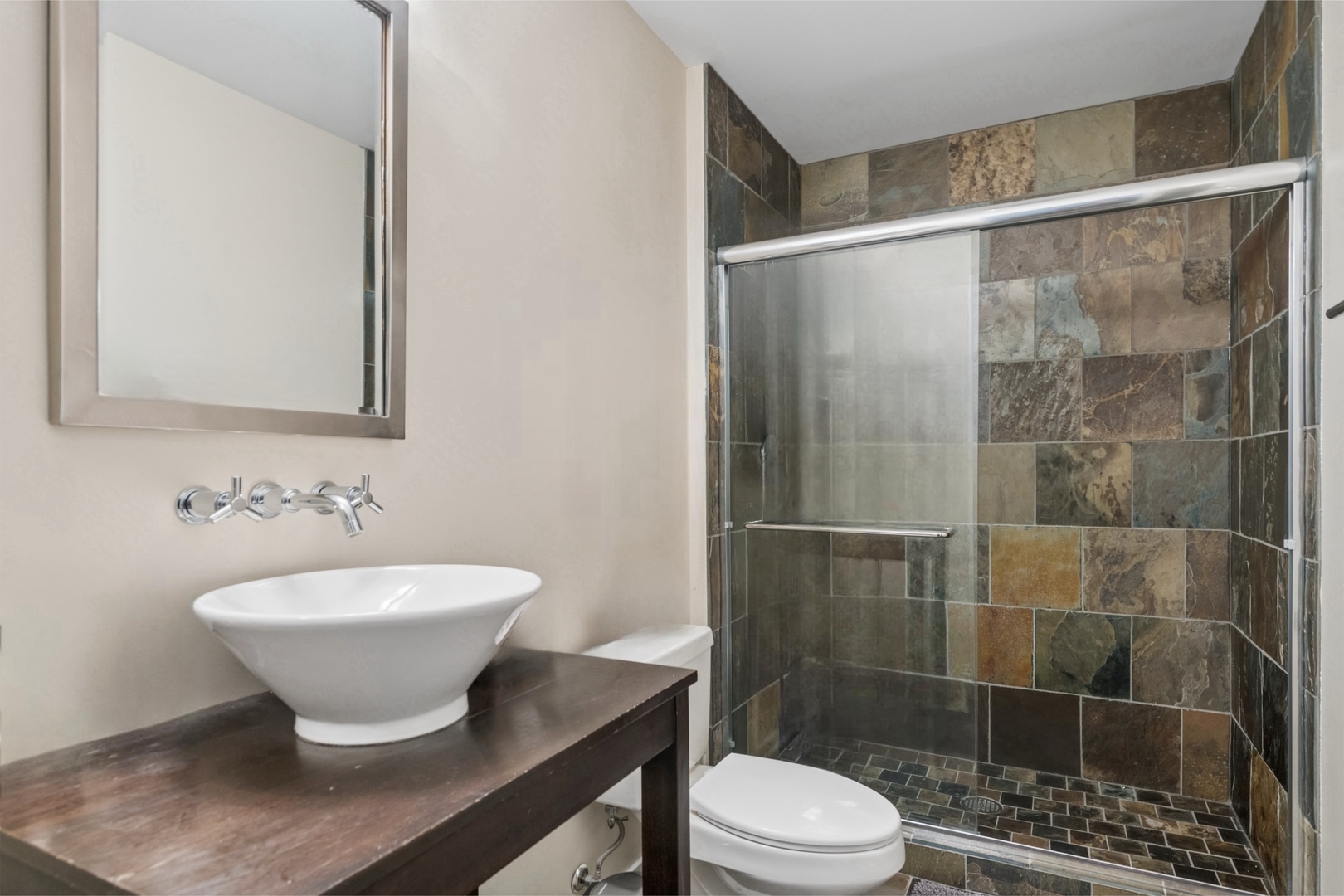 500 West Superior Street, Unit 813 Chicago, IL 60654 - Photo 14 of 18 a bathroom with a sink and a mirror