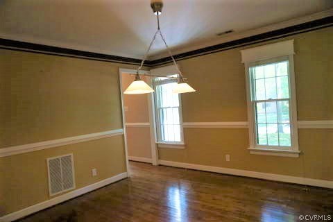 3214 Barnes Spring Terrace Midlothian, VA 23112 - Photo 3 of 36 a view of an empty room with wooden floor and a window