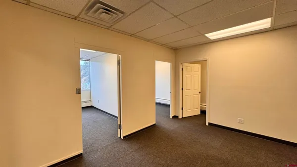 a view of an empty room with a window
