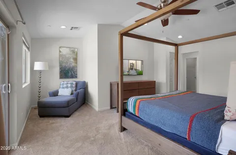 a bedroom with a bed and a couch