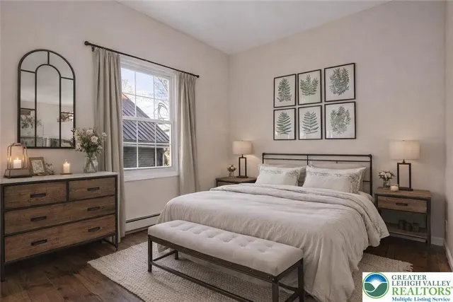 a bedroom with a bed and a dresser