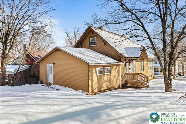 a view of a house with a snow