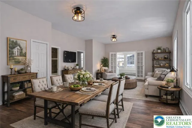 a view of a dining room with furniture window and wooden floor
