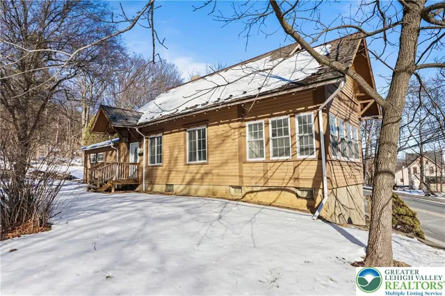 a view of a house with a iron gate