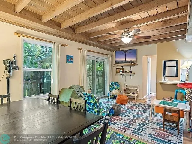 a dining room with table and chairs