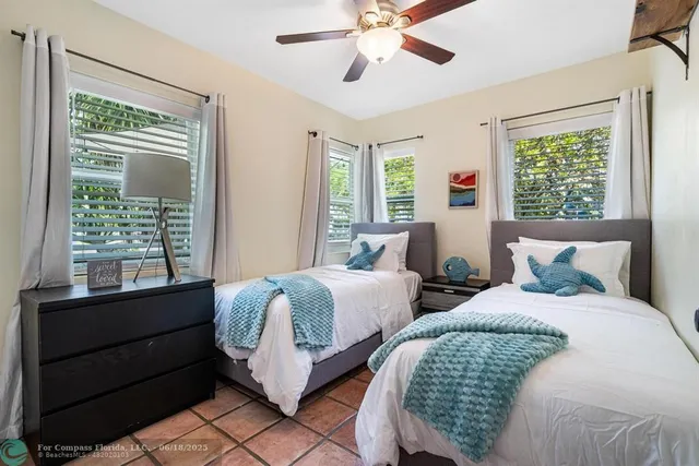 a bedroom with a bed and a mirror