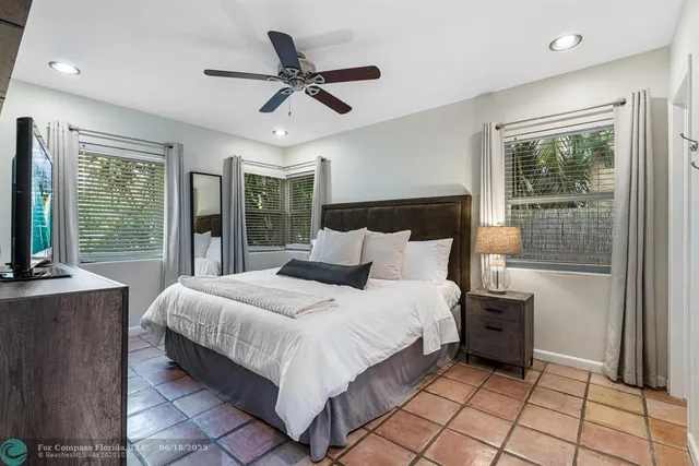 a bedroom with furniture and a window