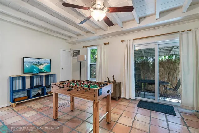 a backyard of a house with yard and outdoor seating