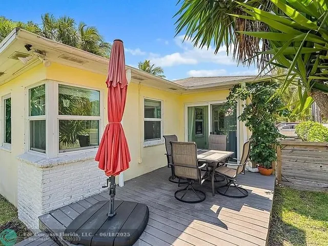a swimming pool with lots of tress in front of it